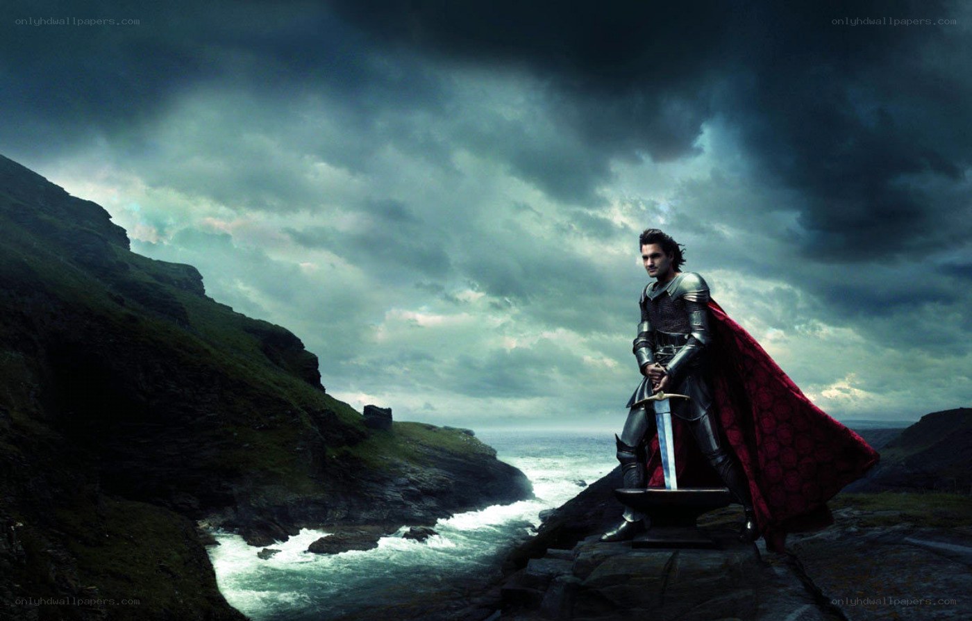 knight with sword on cliff