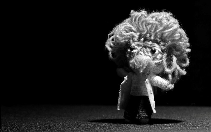 knitted doll with curly hair