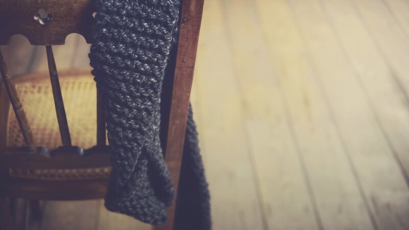 Knitted scarf on wooden chair