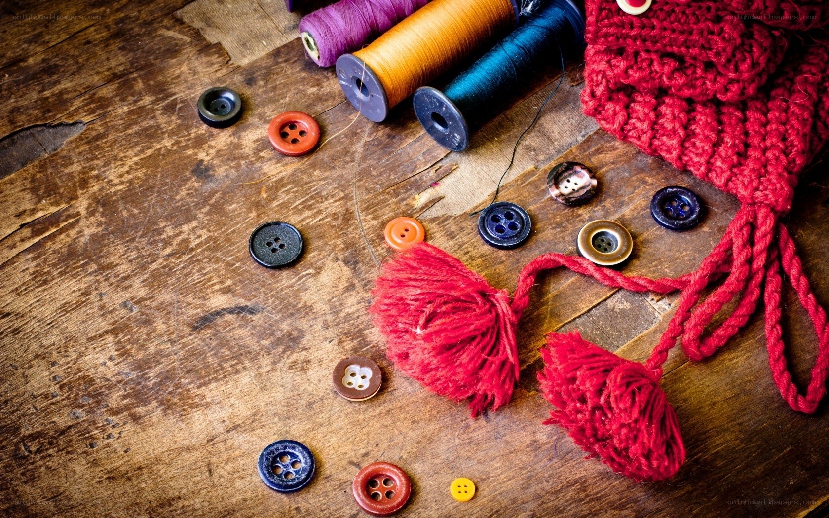 Knitting supplies on wooden table