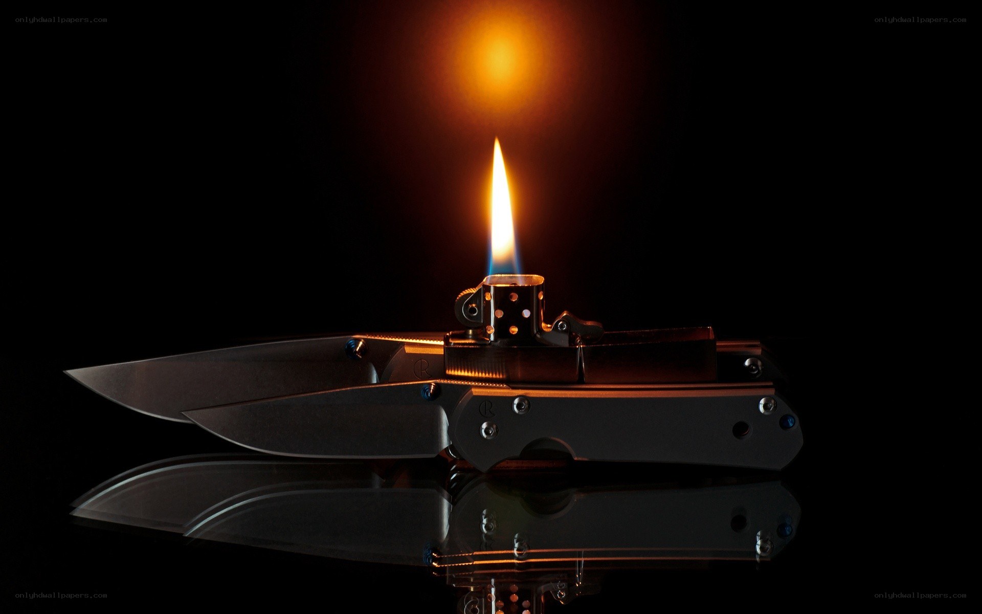 Knives and a lit lighter