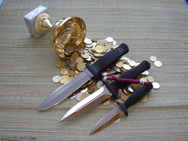 Knives and coins on mat