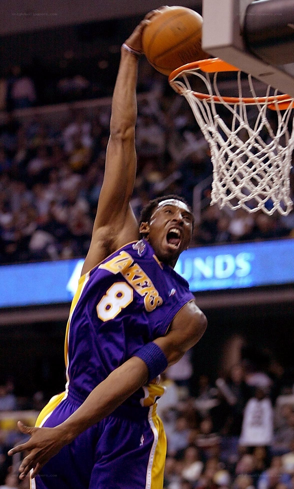 Kobe Bryant dunks the ball