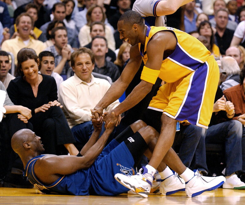 Kobe Bryant helping Michael Jordan up
