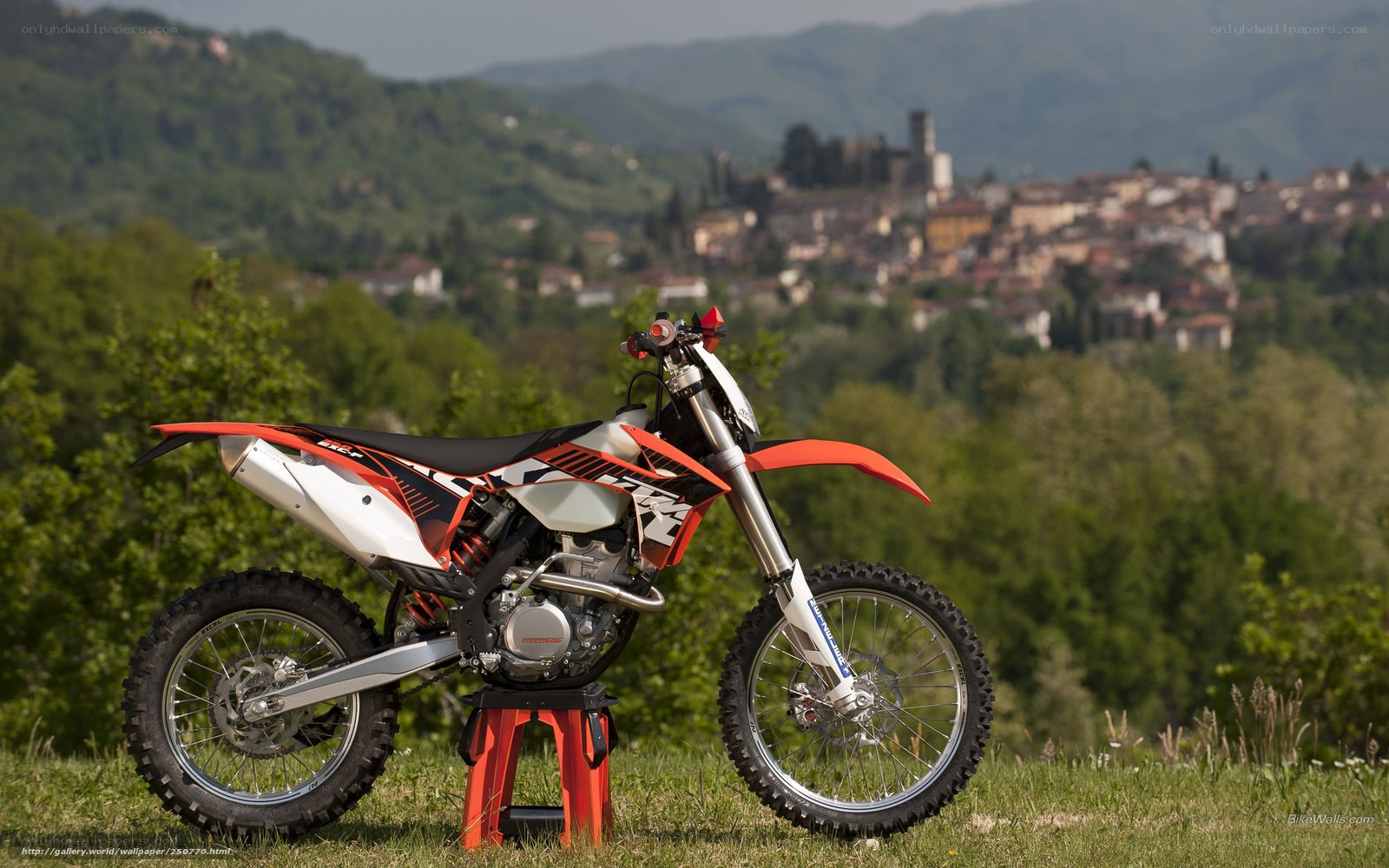 KTM dirt bike on grassy hill