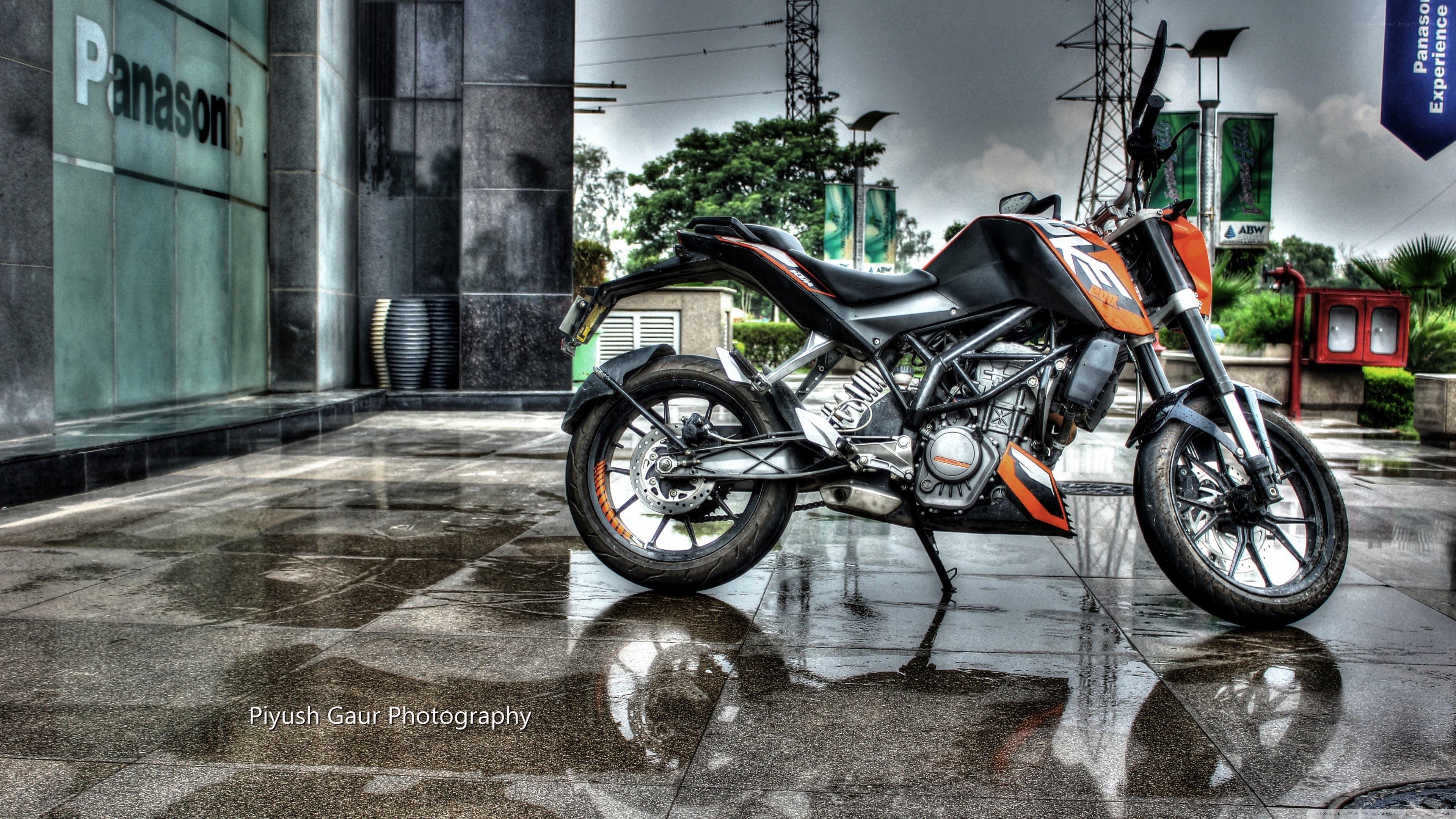 KTM motorcycle on wet pavement