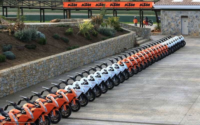 KTM motorcycles in a row