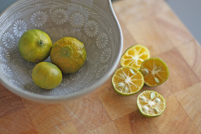 kumquats on a cutting board