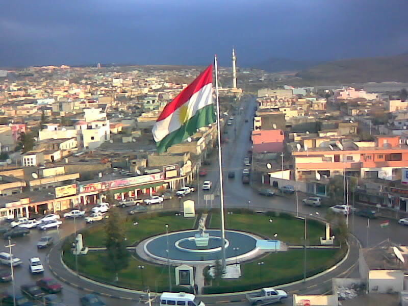 Kurdish flag in city roundabout