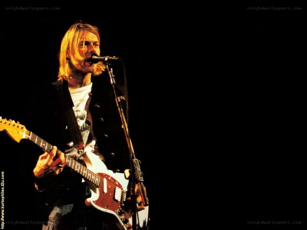 Kurt Cobain performing on stage
