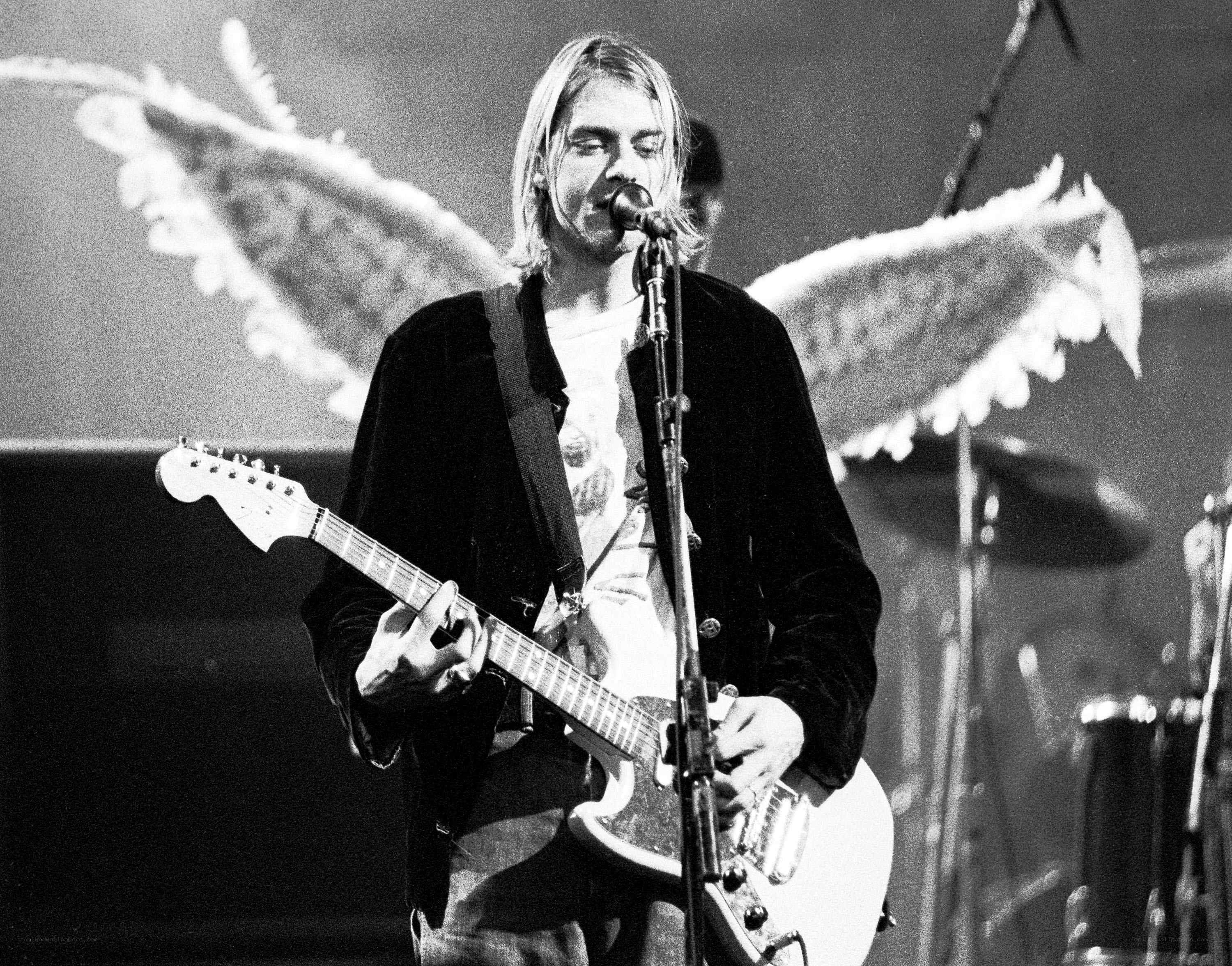 Kurt Cobain performing on stage