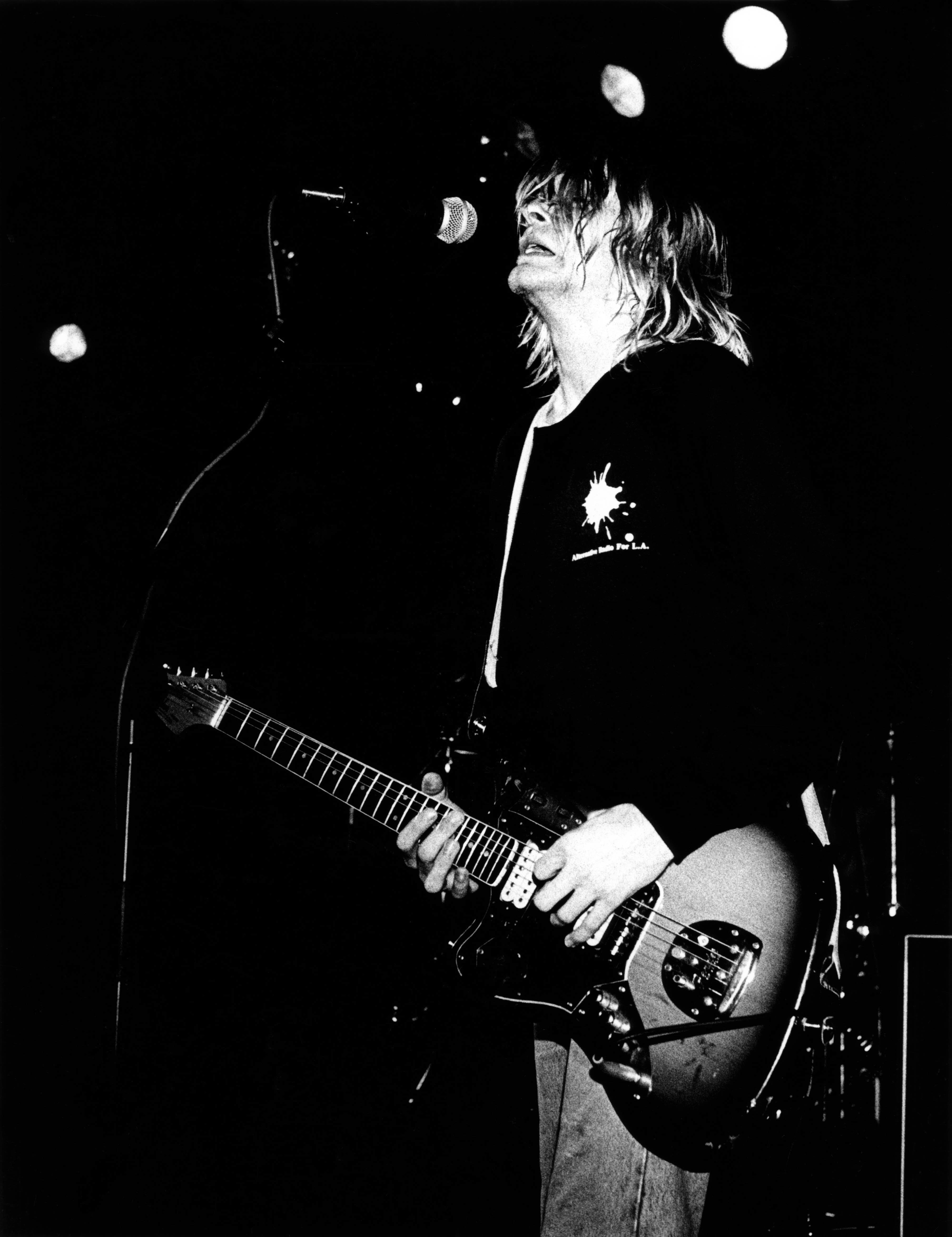 Kurt Cobain performing on stage
