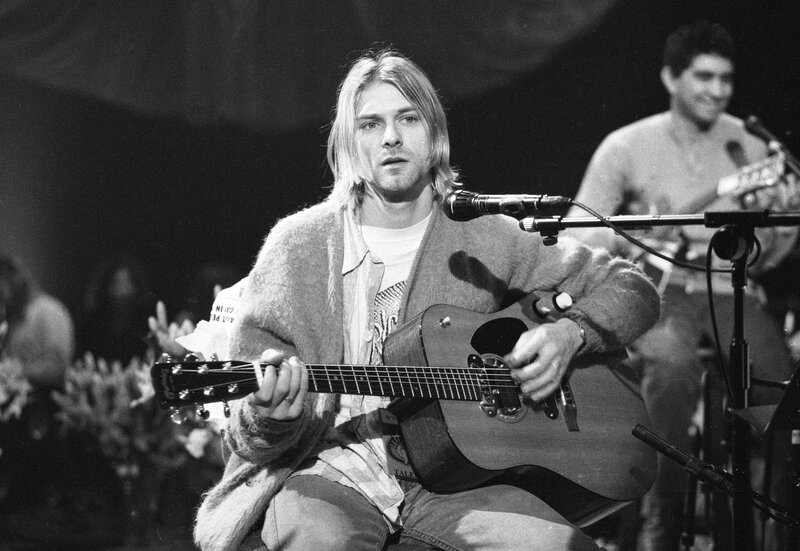 Kurt Cobain performing on stage