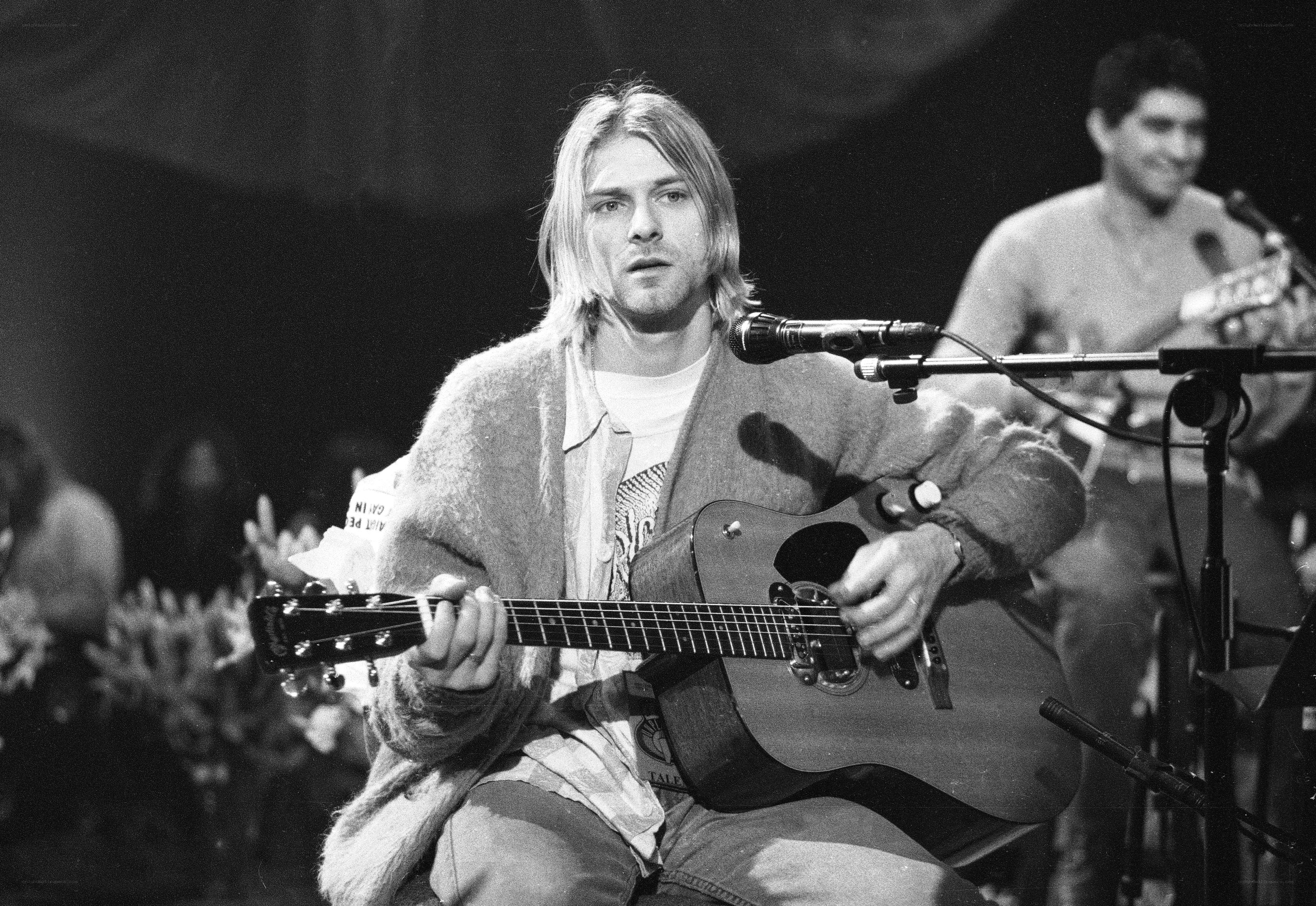 Kurt Cobain performing on stage