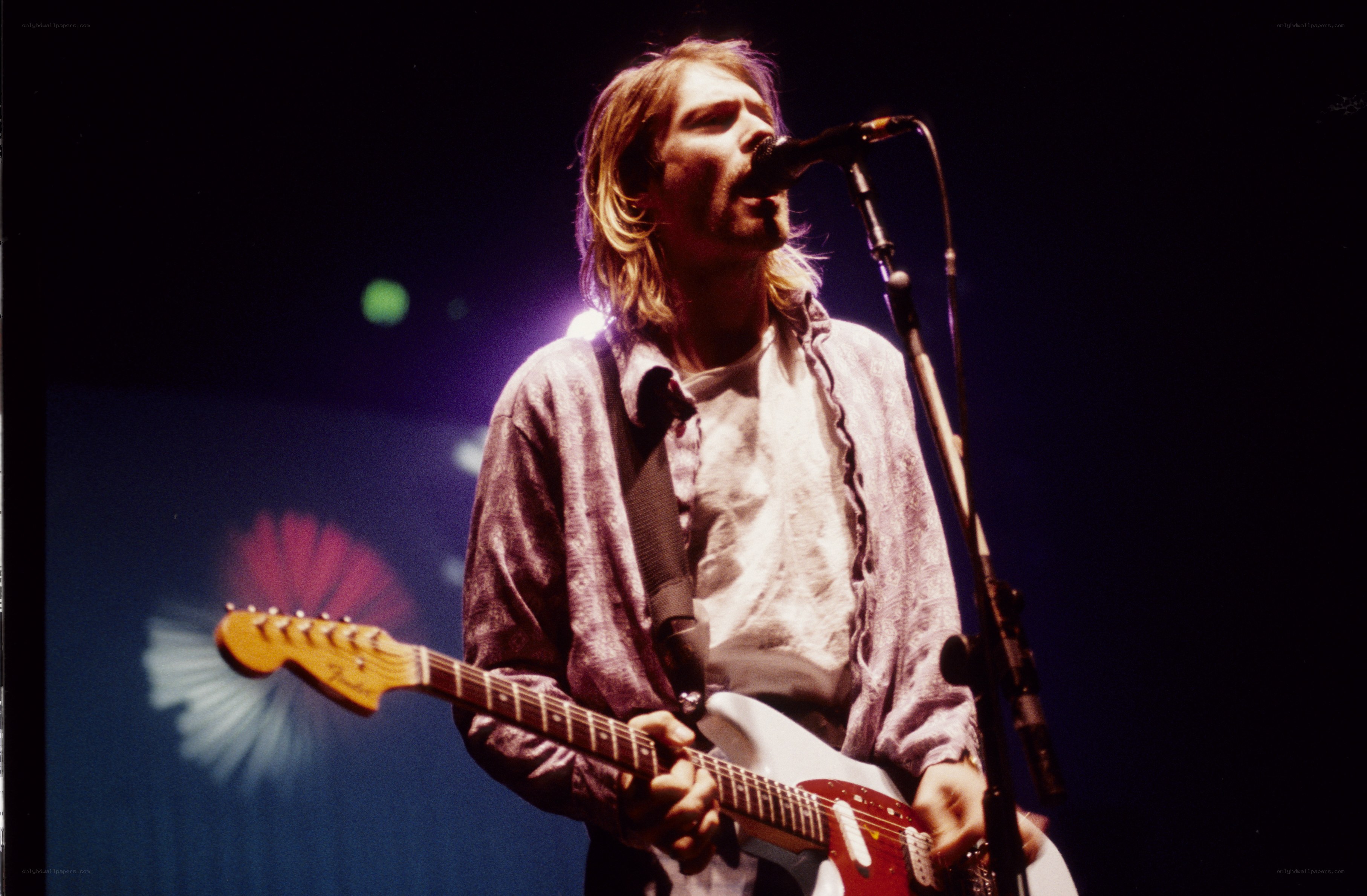 Kurt Cobain performing on stage