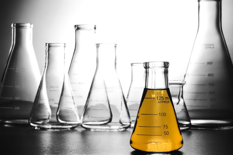 laboratory flasks with yellow liquid