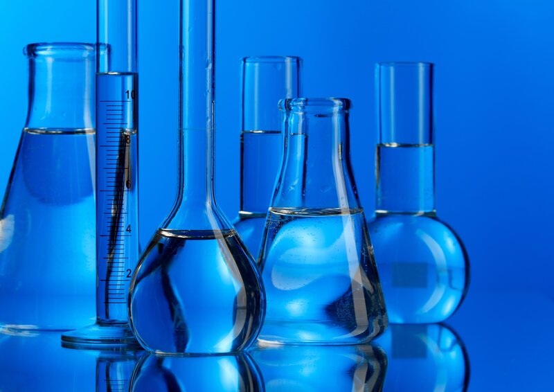 laboratory glassware with blue liquid