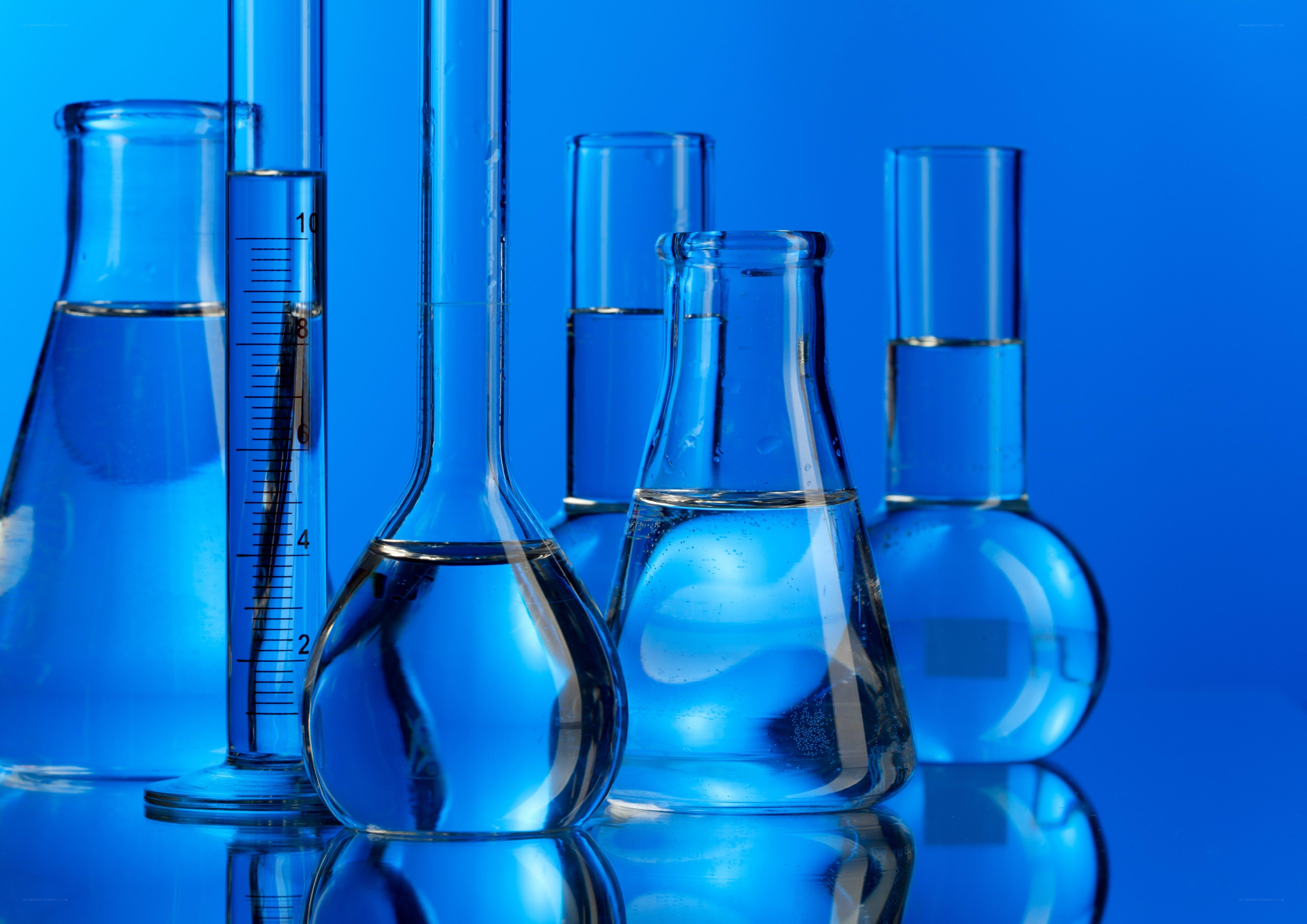 laboratory glassware with blue liquid
