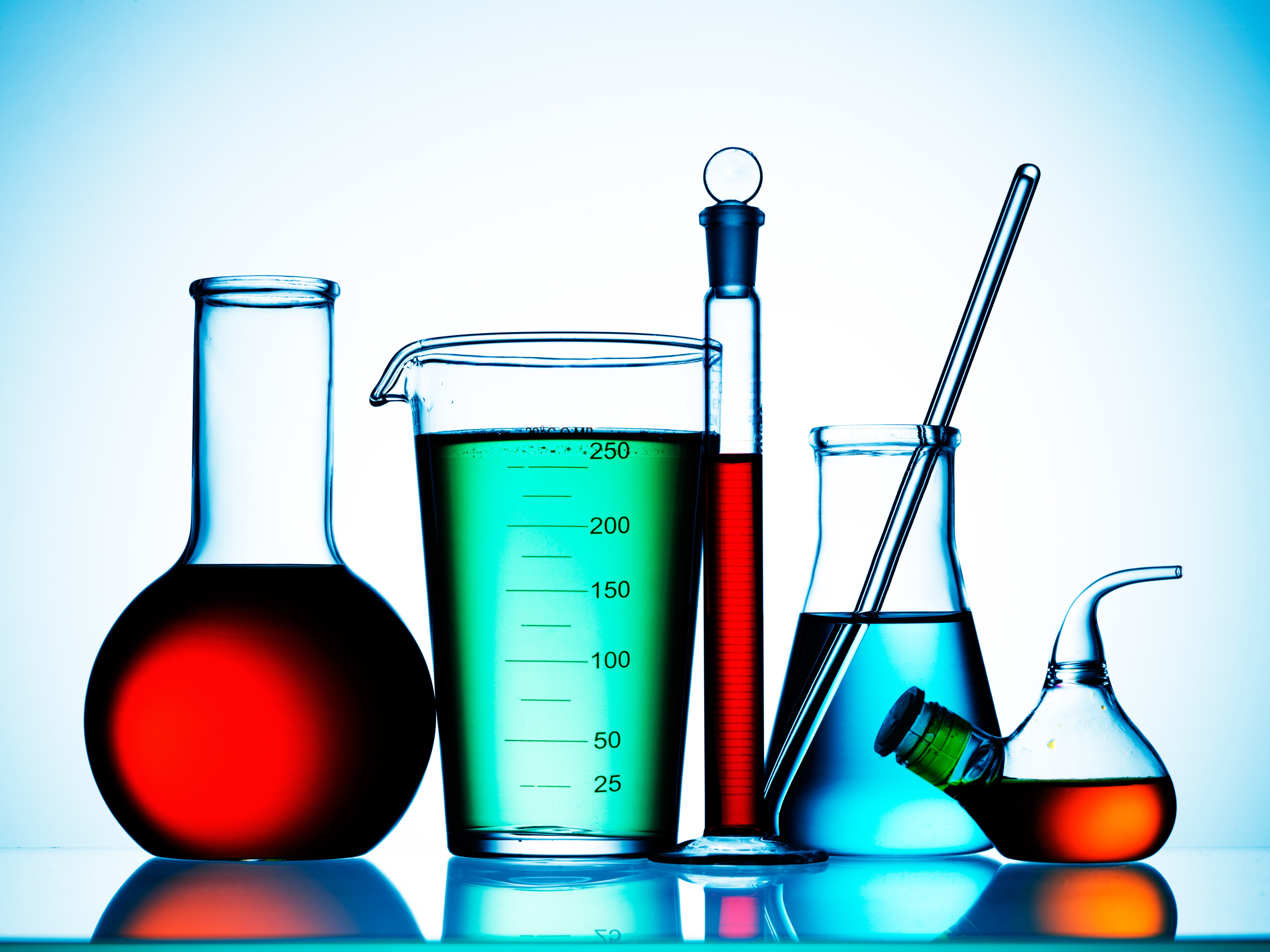 laboratory glassware with colored liquids