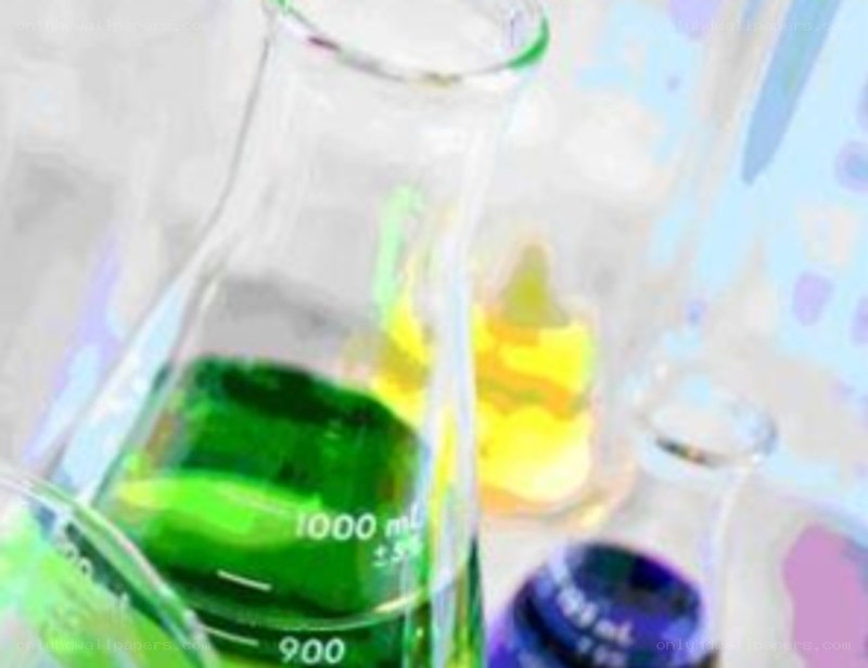 laboratory glassware with colored liquids
