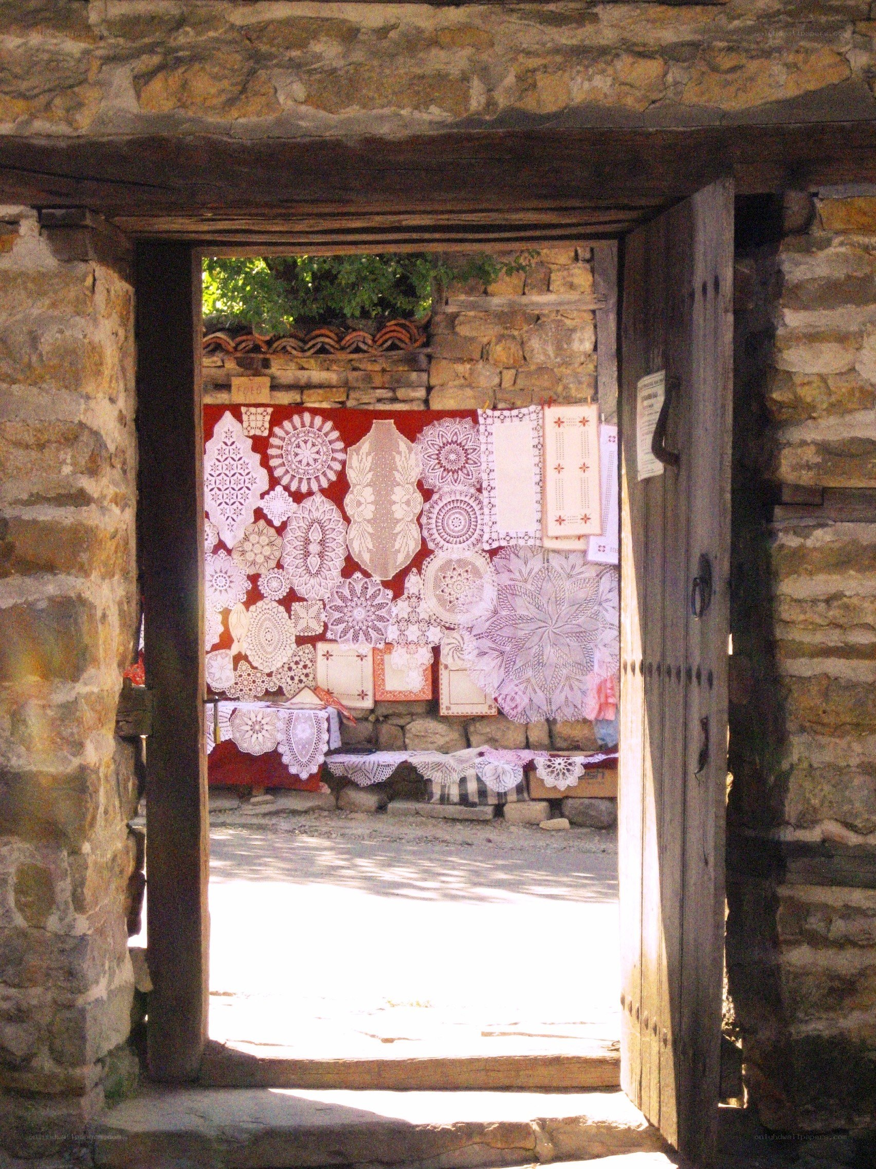 Lace display in stone doorway