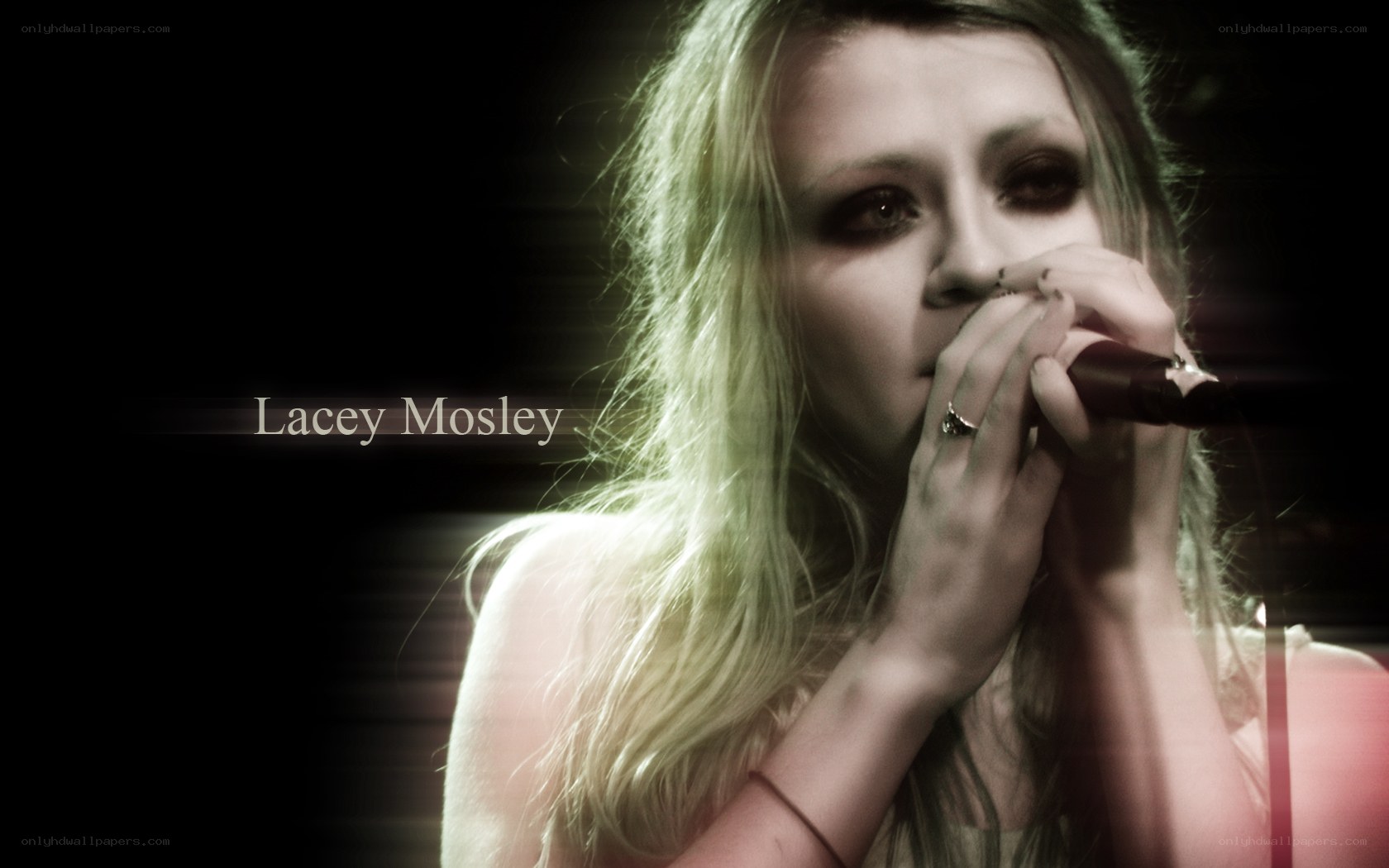 Lacey Mosley singing into microphone