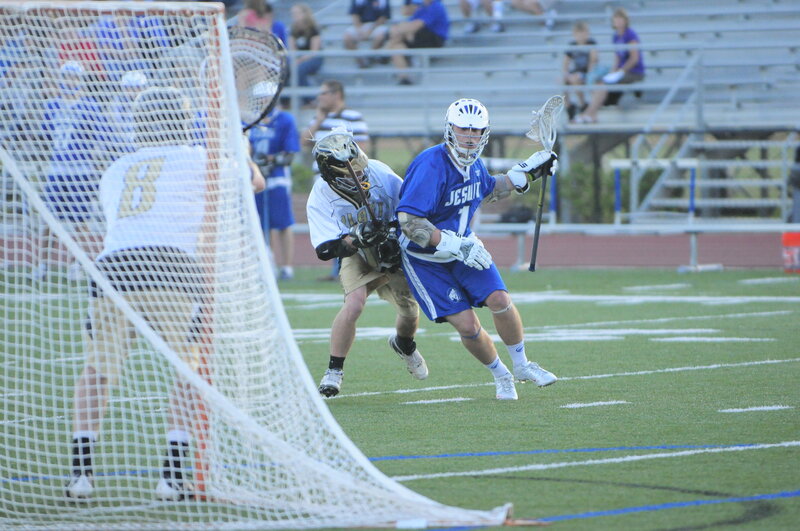 Lacrosse player shooting at goal