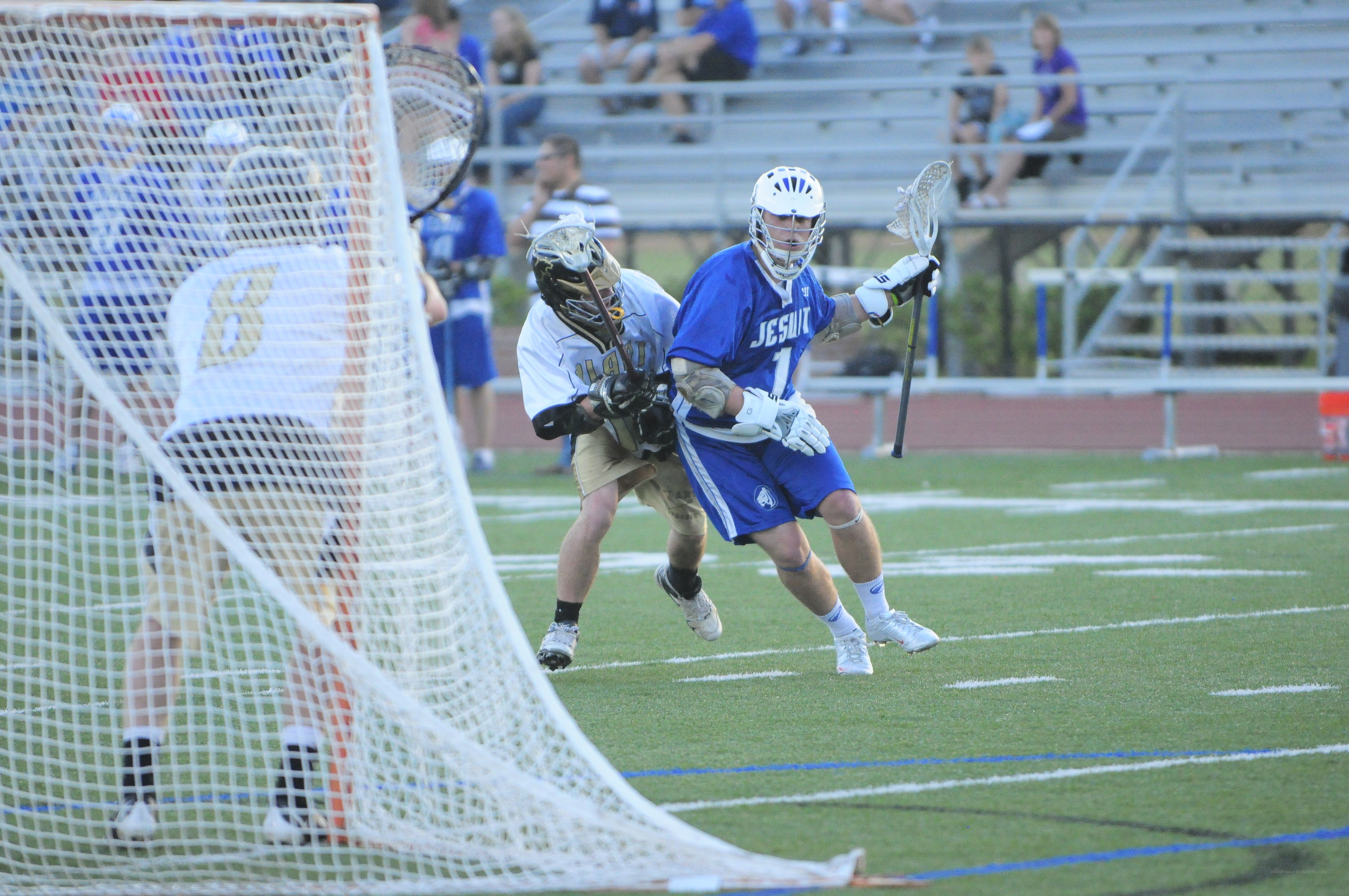 Lacrosse player shooting at goal