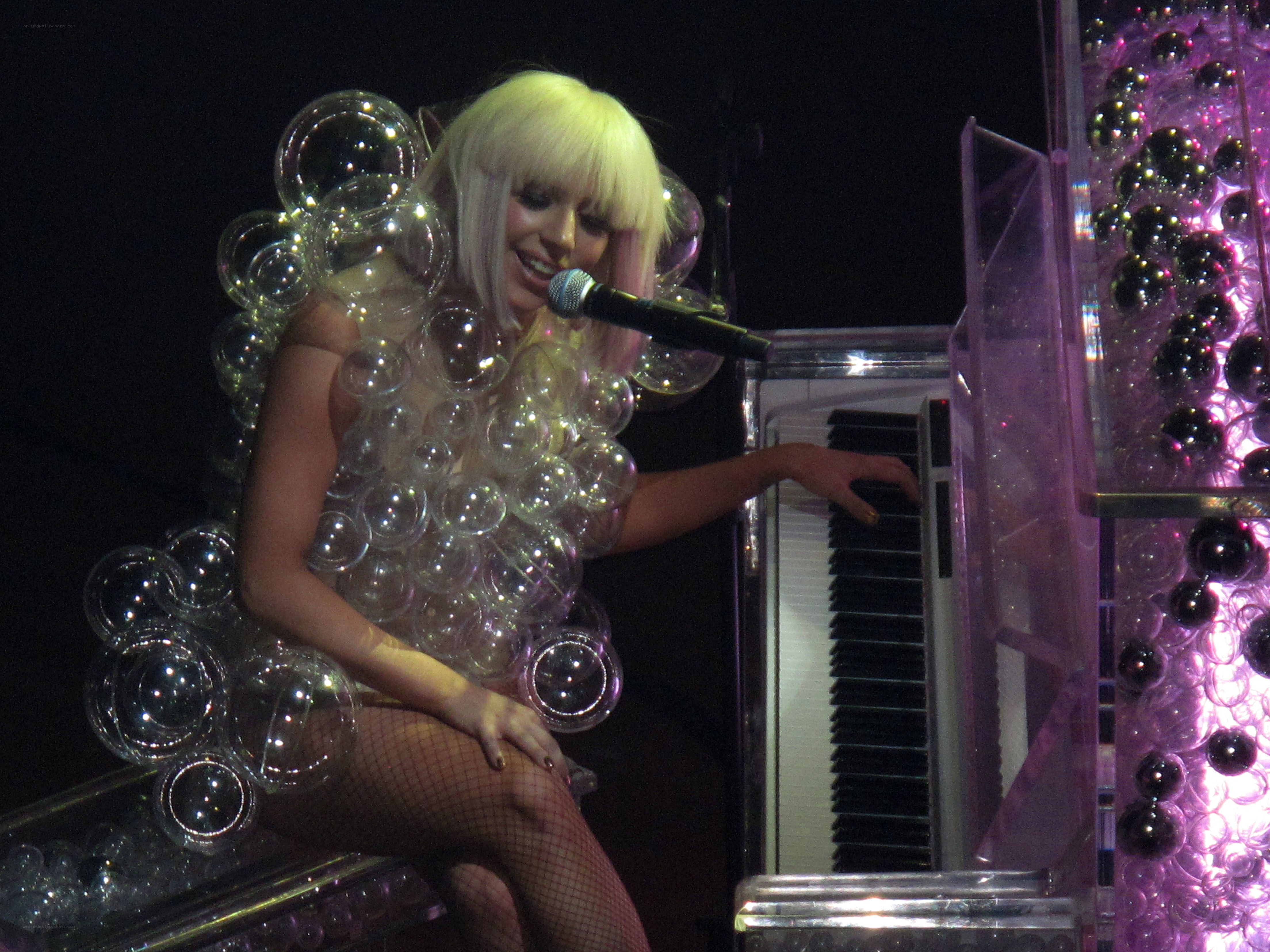 Lady Gaga on piano with bubbles