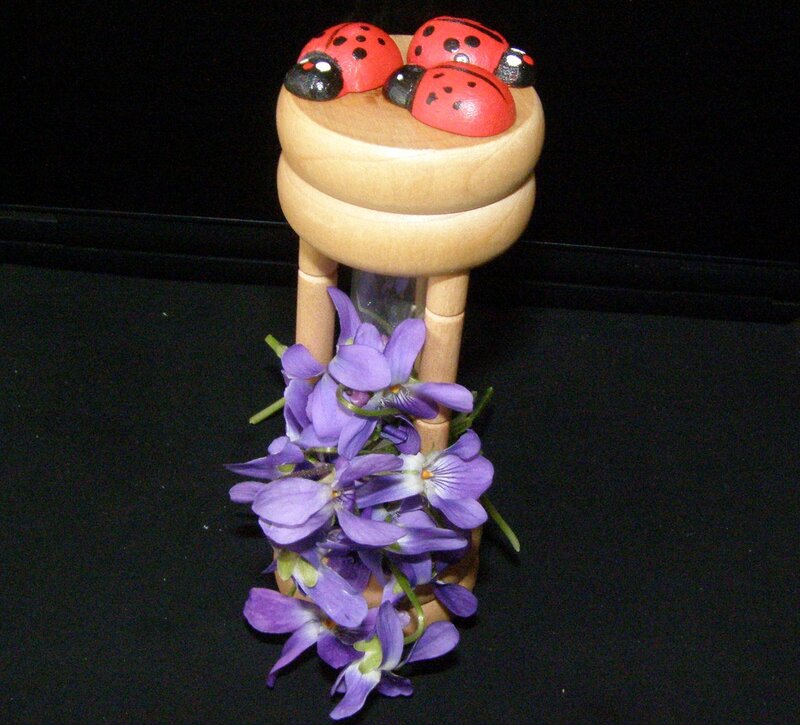 Ladybug hourglass with violets