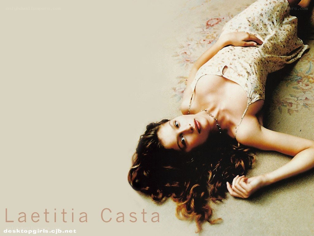 Laetitia Casta lying on floor