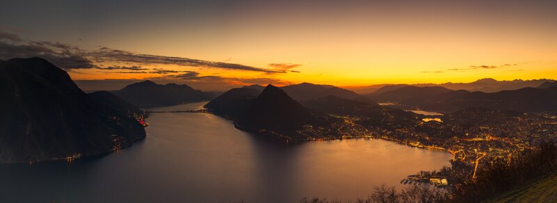 Lake and Mountains at Sunset — Orange, Serene, Photograph, City Lights