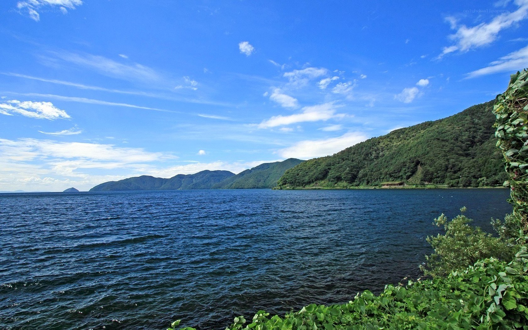 Lake and mountains under blue sky