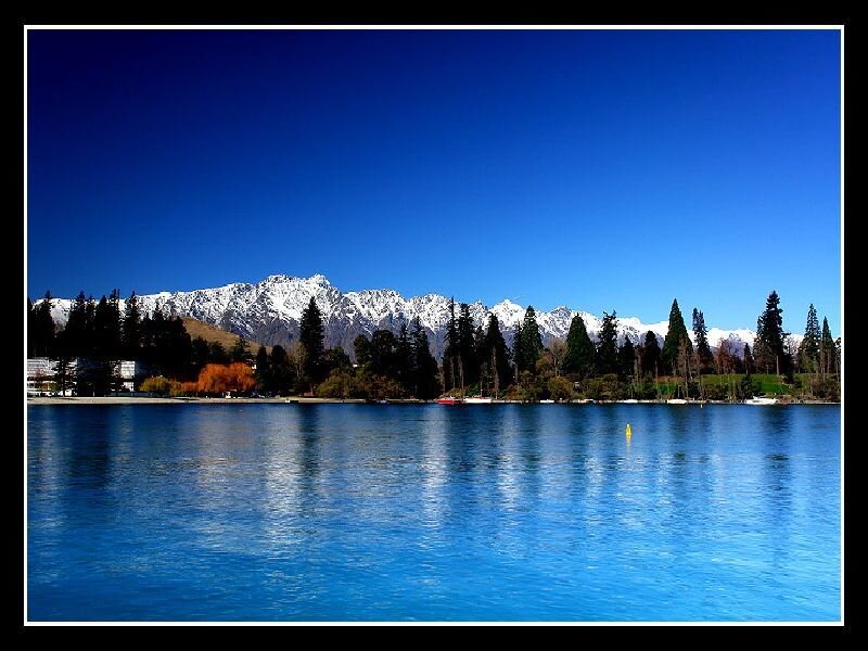 Lake and snow-capped mountains