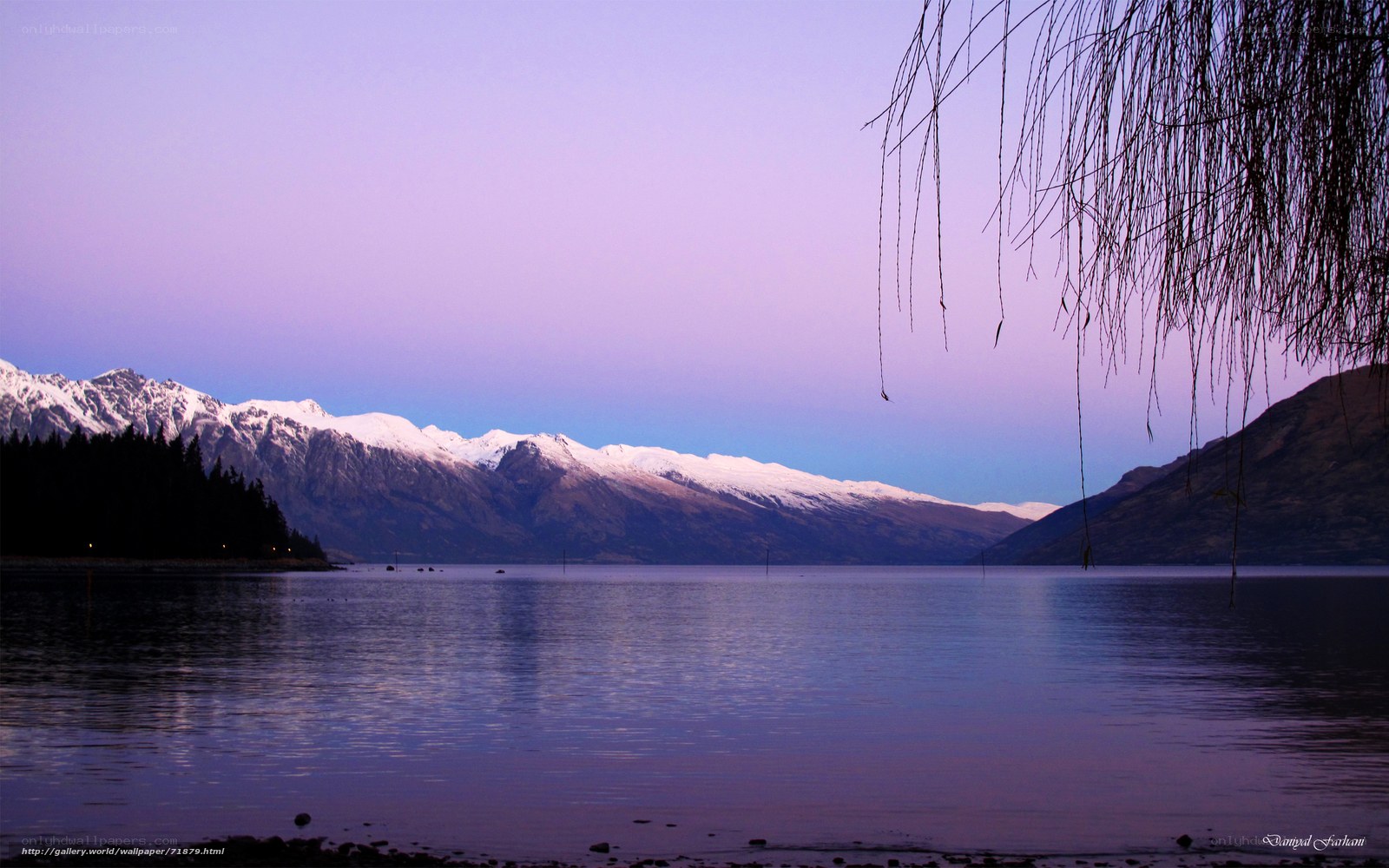Lake and snow-capped mountains at dusk