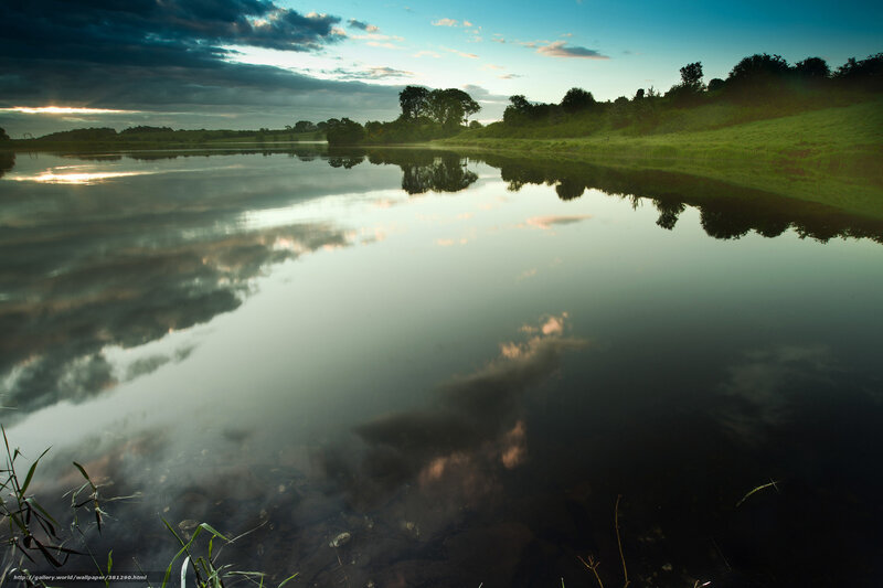 Lake at dusk with cloud reflections