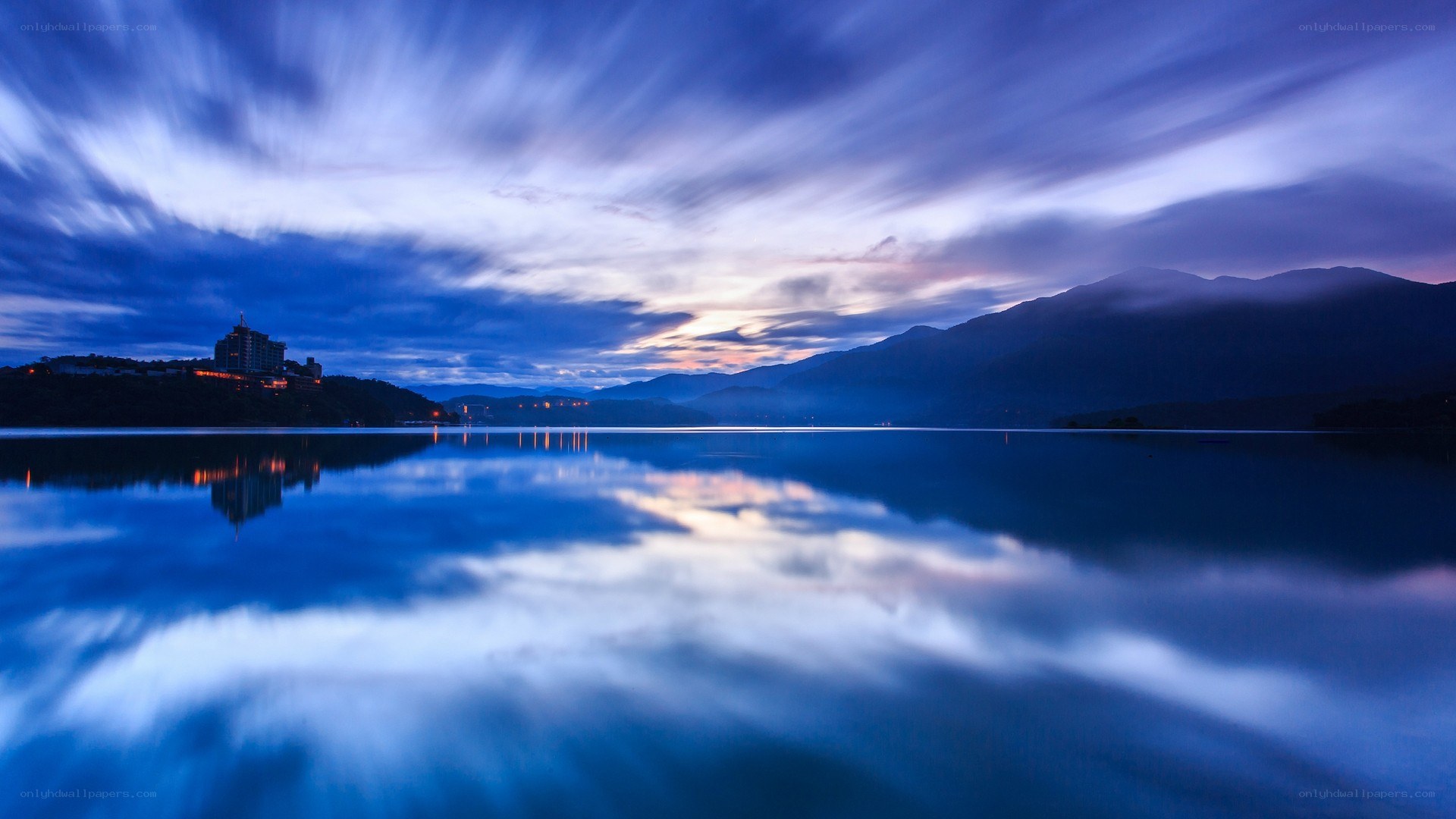 Lake at dusk with mountain reflection