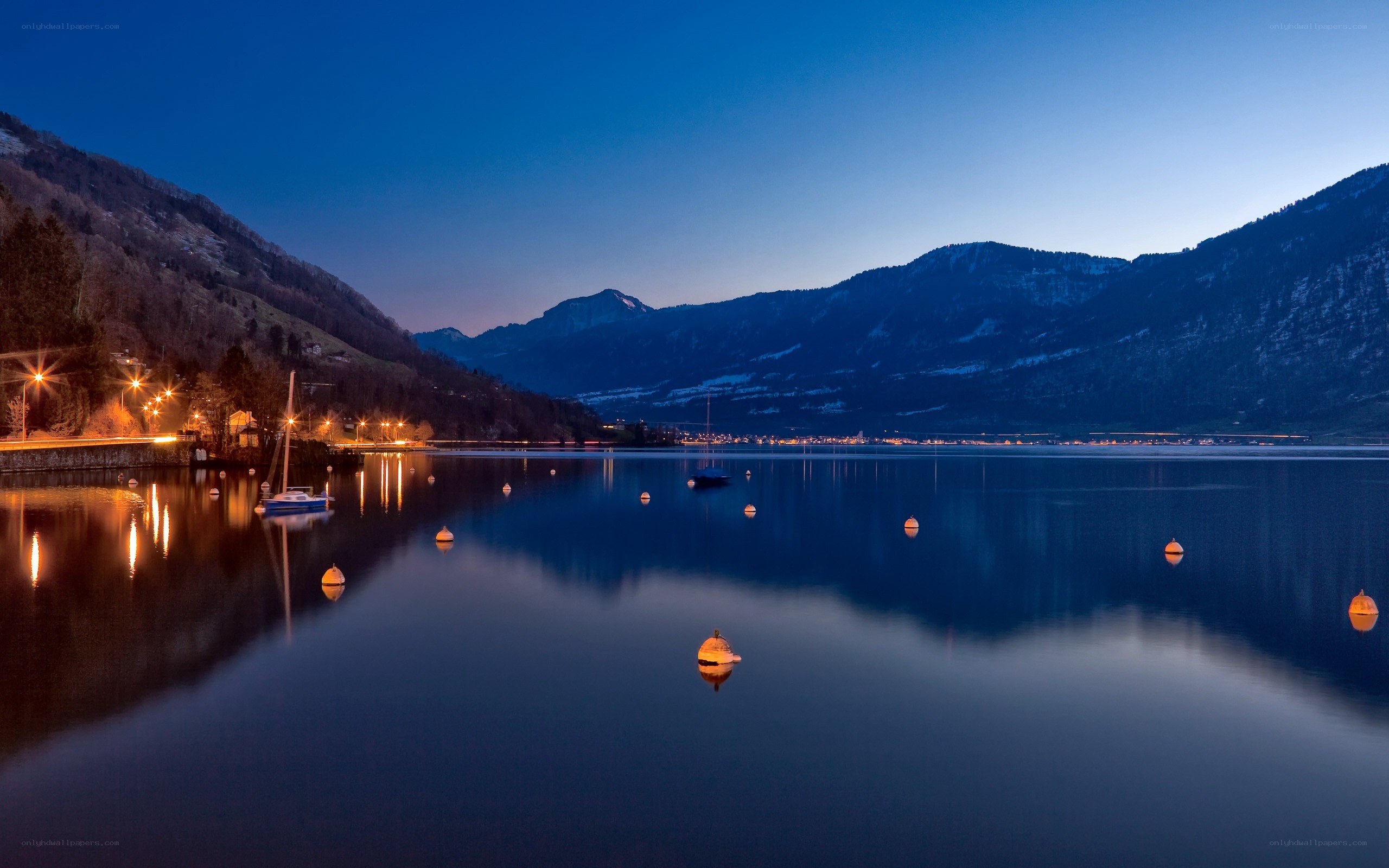 Lake at dusk with mountains