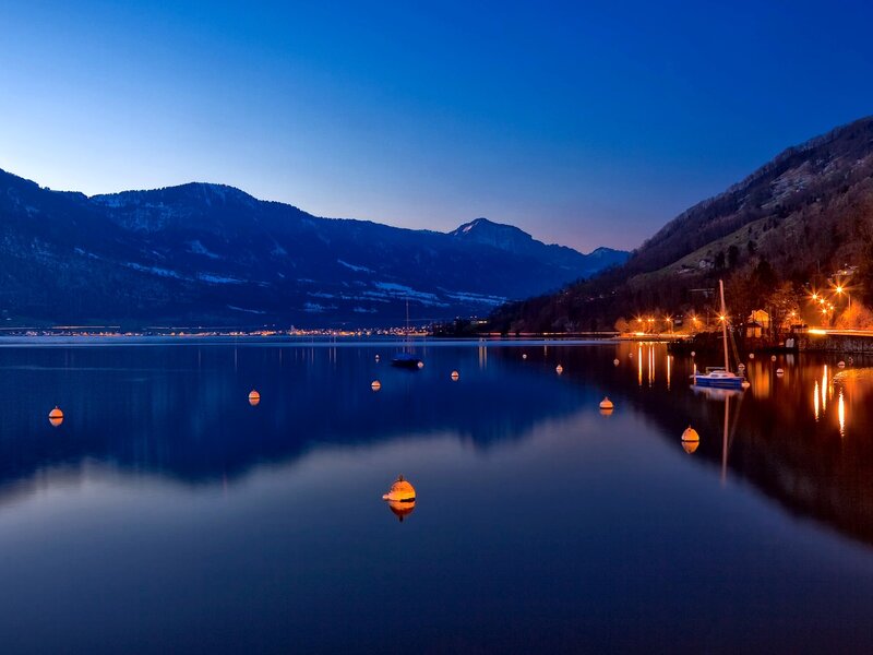 Lake at dusk with mountains