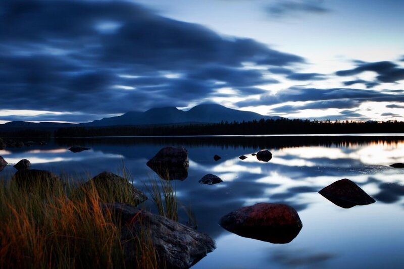 Lake at dusk with mountains