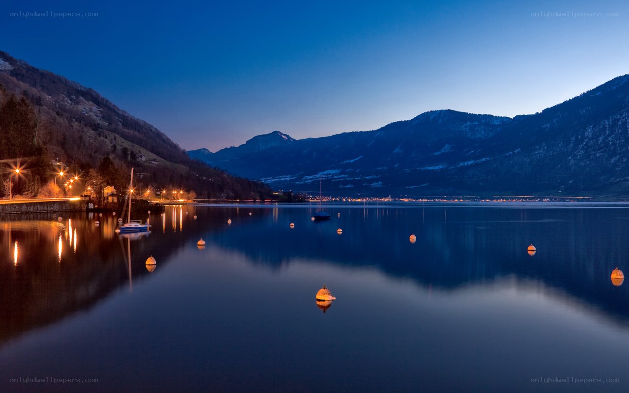 Lake at dusk with mountains
