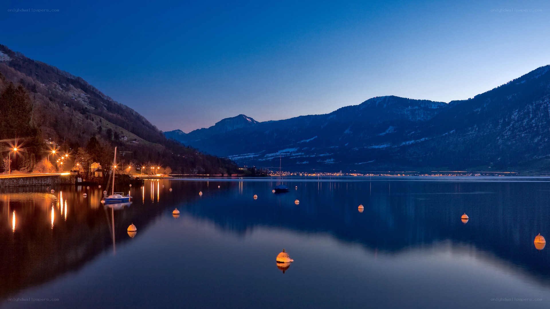 Lake at dusk with mountains