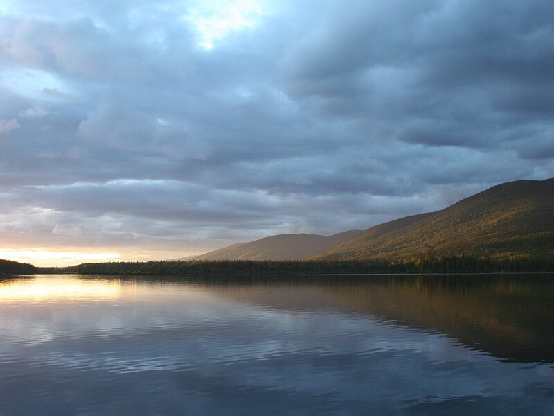 Lake at dusk with mountains