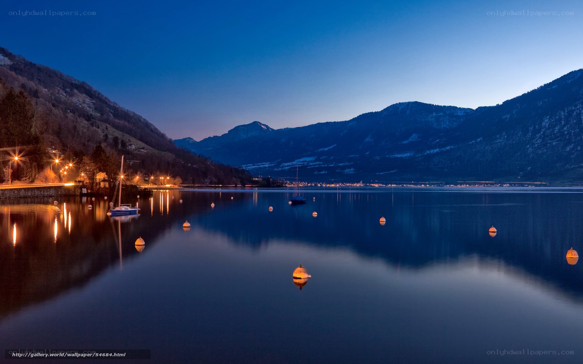 Lake at dusk with mountains