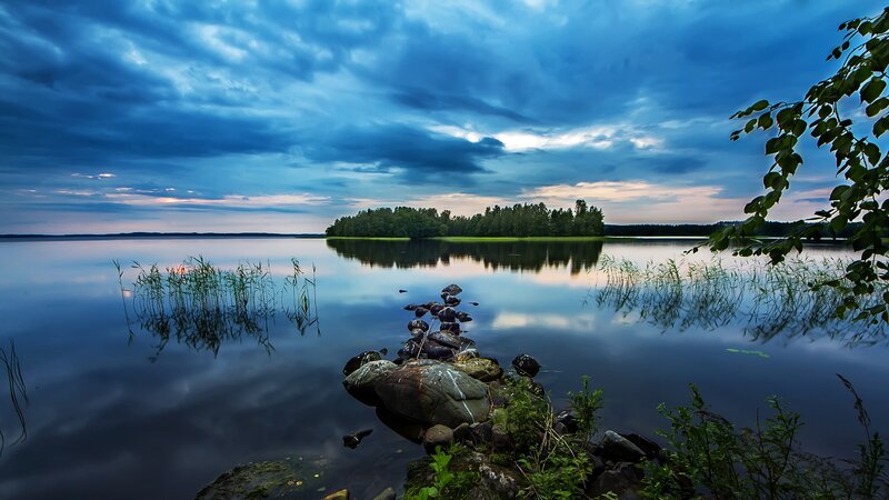 Lake at dusk with rocky shore