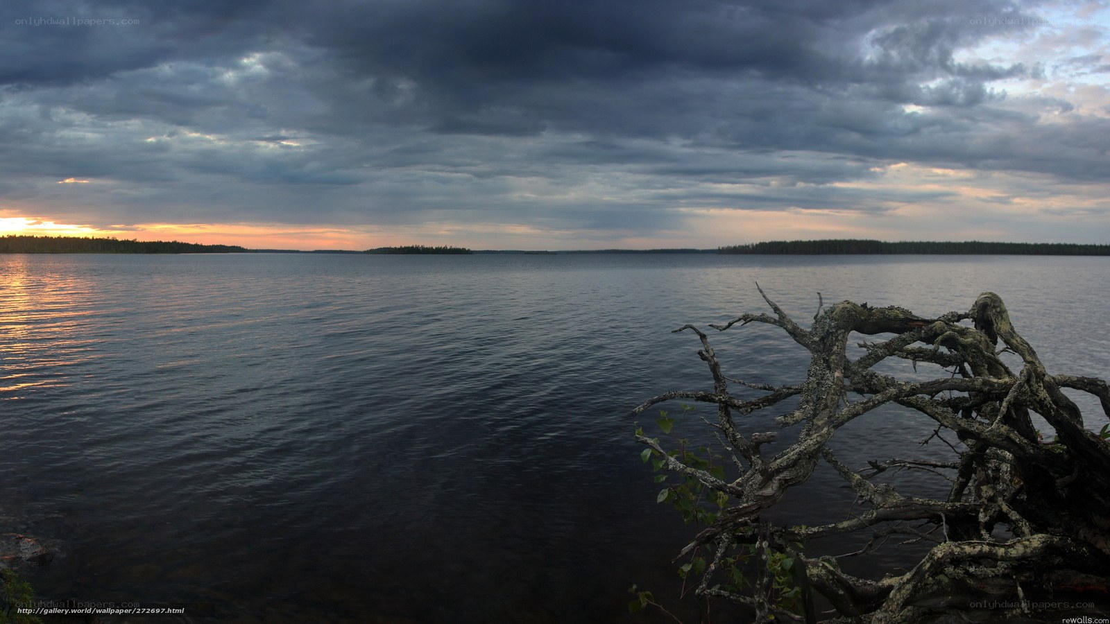 Lake at dusk with storm clouds