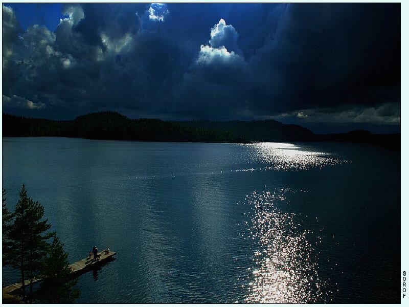 Lake at dusk with sunlit water