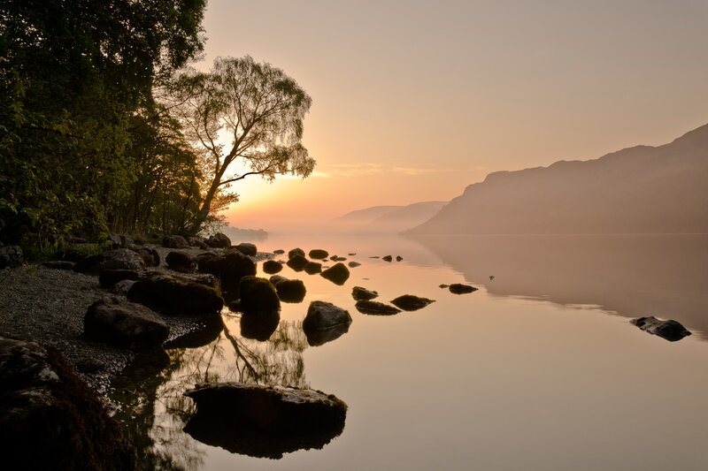 Lake at Sunrise — Orange, Serene, Photograph, Trees, Rocks, Mountains