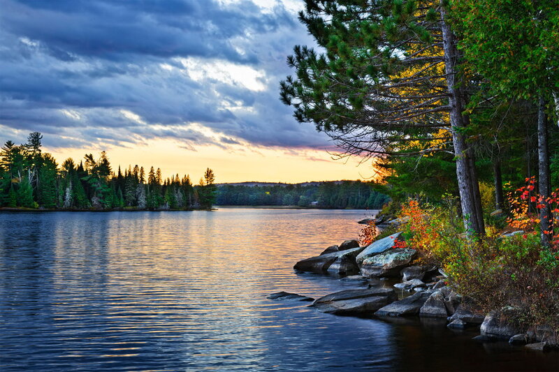 Lake at Sunset — Blue, Serene, Photograph, Trees, Rocks, Clouds