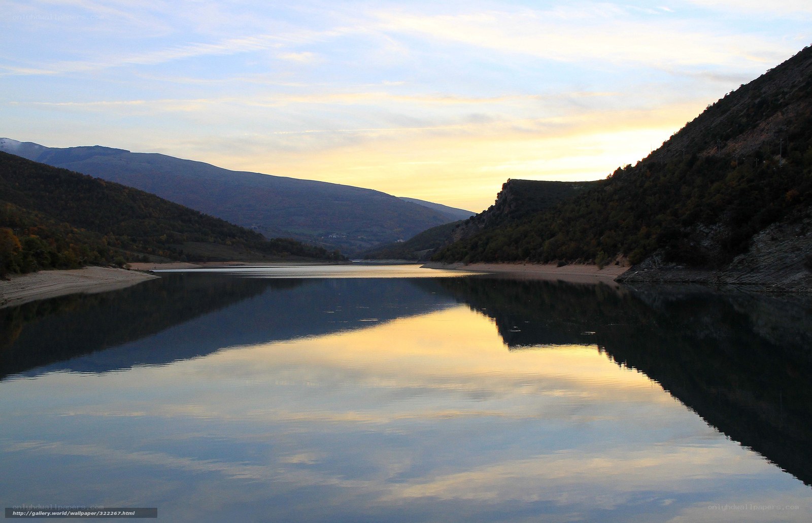 Lake at sunset in mountain valley